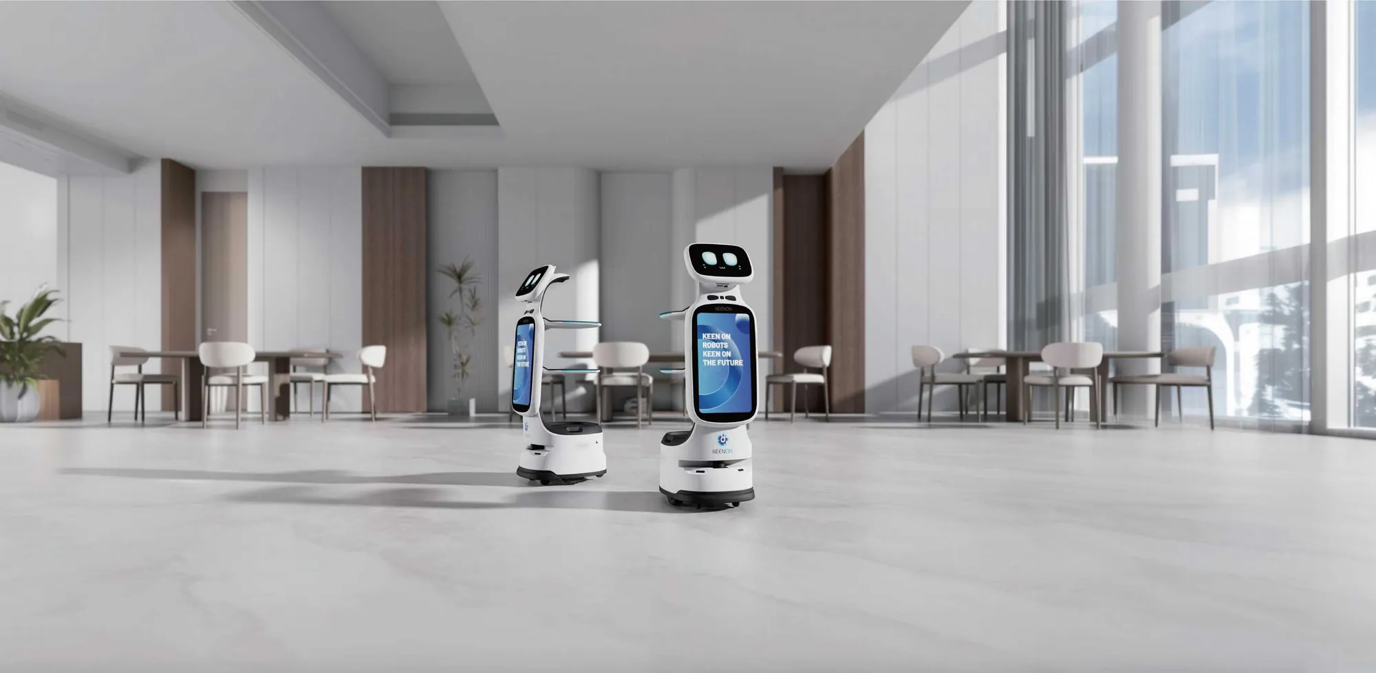 Robots Keenon T11 en la entrada de un establecimiento retail